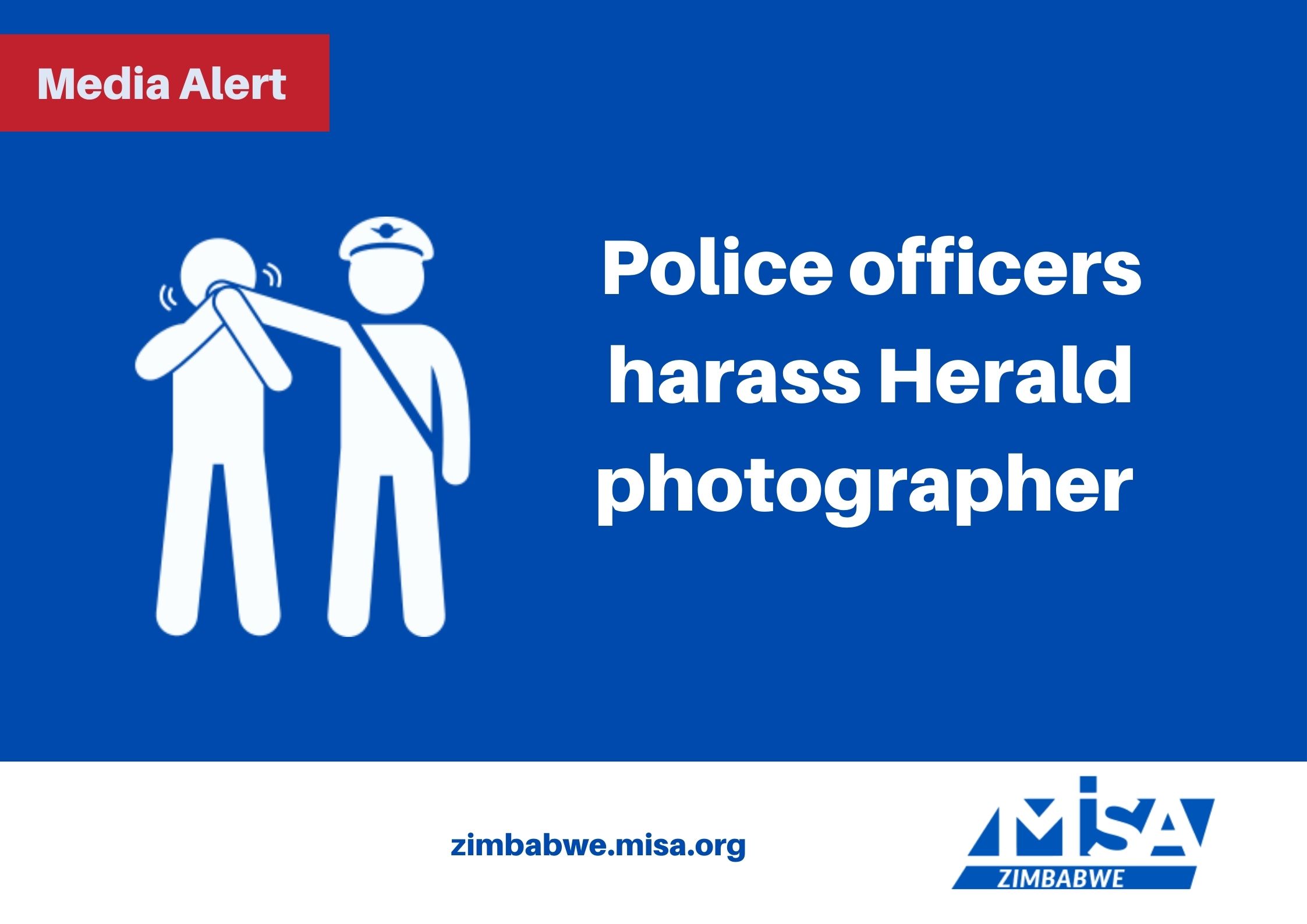 Police officers harass Herald photographer